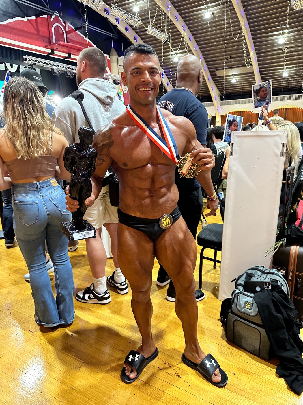 Gio Melchor holding his trophy and medal after a competition win